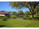 A peaceful view of the community pond with picnic tables at 1610 Spinning Wheel Dr, Lutz, FL 33559