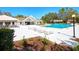Community pool offers lounge chairs and covered seating at 1610 Spinning Wheel Dr, Lutz, FL 33559