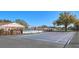 Community tennis court with a covered gazebo and access to the pool area, perfect for active lifestyles at 1610 Spinning Wheel Dr, Lutz, FL 33559