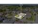An aerial view shows the home's location in a suburban neighborhood with ponds and trees at 32554 Silvercreek Way, Wesley Chapel, FL 33545