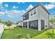This is a fenced backyard with a well-maintained lawn and a screened-in patio at 32554 Silvercreek Way, Wesley Chapel, FL 33545