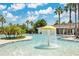 The community pool has a water feature and lots of room to swim at 32554 Silvercreek Way, Wesley Chapel, FL 33545