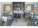 Comfortable dining area includes a kitchenette, seating, modern stainless steel microwave and beverage refrigerator at 32554 Silvercreek Way, Wesley Chapel, FL 33545