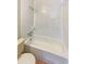 Bathroom featuring tub and shower with white tile at 701 71St N Ave, St Petersburg, FL 33702