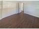 Bedroom featuring neutral walls, hardwood floors, closet, and ample natural light at 701 71St N Ave, St Petersburg, FL 33702