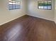 Bedroom with wood-look flooring and natural light at 701 71St N Ave, St Petersburg, FL 33702