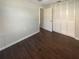 Bedroom with wood-look flooring, closet and natural light at 701 71St N Ave, St Petersburg, FL 33702