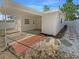 Charming home exterior featuring a covered carport and brick paver walkway at 701 71St N Ave, St Petersburg, FL 33702