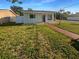 Charming single-story home with a well-maintained lawn and inviting front porch at 701 71St N Ave, St Petersburg, FL 33702
