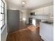 Modern kitchen with stainless steel appliances and white cabinetry at 701 71St N Ave, St Petersburg, FL 33702