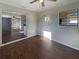Open-concept living room with wood-look tile flooring and ample natural light at 701 71St N Ave, St Petersburg, FL 33702