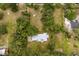 Aerial view of estate home surrounded by mature trees and green space at 10809 Cedar Cove Drive, Thonotosassa, FL 33592