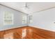 Bedroom with hardwood floors, a ceiling fan, and great natural light at 10809 Cedar Cove Drive, Thonotosassa, FL 33592