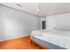 View of bright bedroom with a ceiling fan and hardwood floors at 10809 Cedar Cove Drive, Thonotosassa, FL 33592