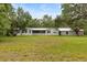 Single story home with metal roof and large front yard at 10809 Cedar Cove Drive, Thonotosassa, FL 33592