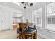 Kitchen nook featuring a wooden table with barstool seating and a view out the window at 10809 Cedar Cove Drive, Thonotosassa, FL 33592