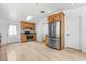 Kitchen boasts stainless steel appliances, wooden cabinets, and plenty of storage space at 10809 Cedar Cove Drive, Thonotosassa, FL 33592