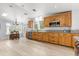 Updated kitchen featuring light hardwood flooring, wooden cabinets, and granite countertops at 10809 Cedar Cove Drive, Thonotosassa, FL 33592