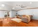 Inviting living room with skylights, hardwood floors, and a comfortable sectional sofa at 10809 Cedar Cove Drive, Thonotosassa, FL 33592
