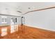 Spacious living room with hardwood floors, and view into a covered lanai at 10809 Cedar Cove Drive, Thonotosassa, FL 33592