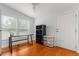 Well-lit office with hardwood floors and two windows at 10809 Cedar Cove Drive, Thonotosassa, FL 33592