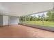 Enclosed porch with screen windows looking out to the backyard at 10809 Cedar Cove Drive, Thonotosassa, FL 33592