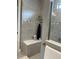 Modern bathroom with a built in bench inside the shower at 1427 Hyssop Loop, North Port, FL 34289