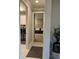 Hallway view into the laundry room and a bedroom with a daybed at 1427 Hyssop Loop, North Port, FL 34289