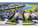 Overhead view of a landscaped home in a community with a lake at 25301 Longmeadow Dr, Punta Gorda, FL 33955