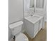 Powder room featuring modern white vanity with neutral countertops at 4914 Trinidad Dr, Land O Lakes, FL 34639
