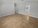 Large bedroom with a partial view of the bathroom with tile floors at 4914 Trinidad Dr, Land O Lakes, FL 34639