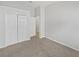 Bedroom featuring two closets and a white door at 4914 Trinidad Dr, Land O Lakes, FL 34639