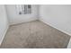 Minimalist bedroom with neutral carpet and ample natural light at 4914 Trinidad Dr, Land O Lakes, FL 34639