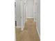 Hallway featuring a tiled floor leading to doorways at 4914 Trinidad Dr, Land O Lakes, FL 34639