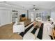 Bright living room featuring stylish furnishings and a ceiling fan at 4914 Trinidad Dr, Land O Lakes, FL 34639