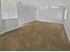 Living room with tile floors, gray walls, and bright white trim at 4914 Trinidad Dr, Land O Lakes, FL 34639