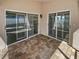 Covered patio with brick flooring, offering a private outdoor space with sliding glass doors at 4914 Trinidad Dr, Land O Lakes, FL 34639