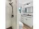 Updated bathroom offers dual shower heads and updated vanity at 961 Charlotte Ave, Sarasota, FL 34237