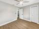 This bedroom offers neutral colors and wood-look floors and ceiling fan at 961 Charlotte Ave, Sarasota, FL 34237