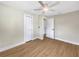 Bedroom boasts wood-look floors, ceiling fan, and large closets at 961 Charlotte Ave, Sarasota, FL 34237