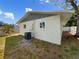 Exterior view of home showcasing backyard and new AC unit at 961 Charlotte Ave, Sarasota, FL 34237