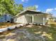 Charming single-story home with a covered porch and freshly landscaped front yard at 961 Charlotte Ave, Sarasota, FL 34237