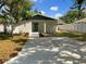 Well-maintained single-story home featuring a long driveway and landscaped front yard at 961 Charlotte Ave, Sarasota, FL 34237