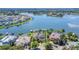 Waterfront home with a private boat dock, lush landscaping, and easy access to the lake at 5405 Merritt Island Dr, Apollo Beach, FL 33572