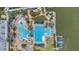 Overhead view of the community pool, including a ' pool and a six-lane pool, with a nearby lake at 5405 Merritt Island Dr, Apollo Beach, FL 33572