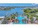 Aerial view of the community's lakefront pool and recreational facilities with palm trees and waterfront views at 5405 Merritt Island Dr, Apollo Beach, FL 33572
