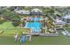 Aerial view of a community pool, clubhouse, and waterfront area at 5405 Merritt Island Dr, Apollo Beach, FL 33572