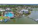 Aerial view of the community clubhouse, pool, and waterfront at 5405 Merritt Island Dr, Apollo Beach, FL 33572