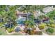 Aerial view of the property showcasing the backyard pool, lush landscaping, and overall layout of the estate at 5405 Merritt Island Dr, Apollo Beach, FL 33572