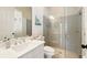 Modern bathroom featuring a glass-enclosed shower and a stylish vanity with double sinks at 5405 Merritt Island Dr, Apollo Beach, FL 33572